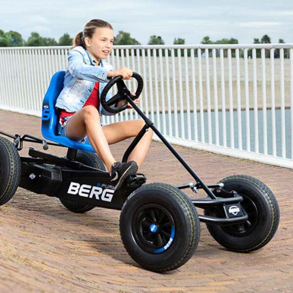 Girl riding BERG XL Basics go-kart, stable and durable design