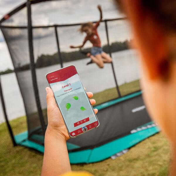 Training with the BERG AirHive app on a trampoline