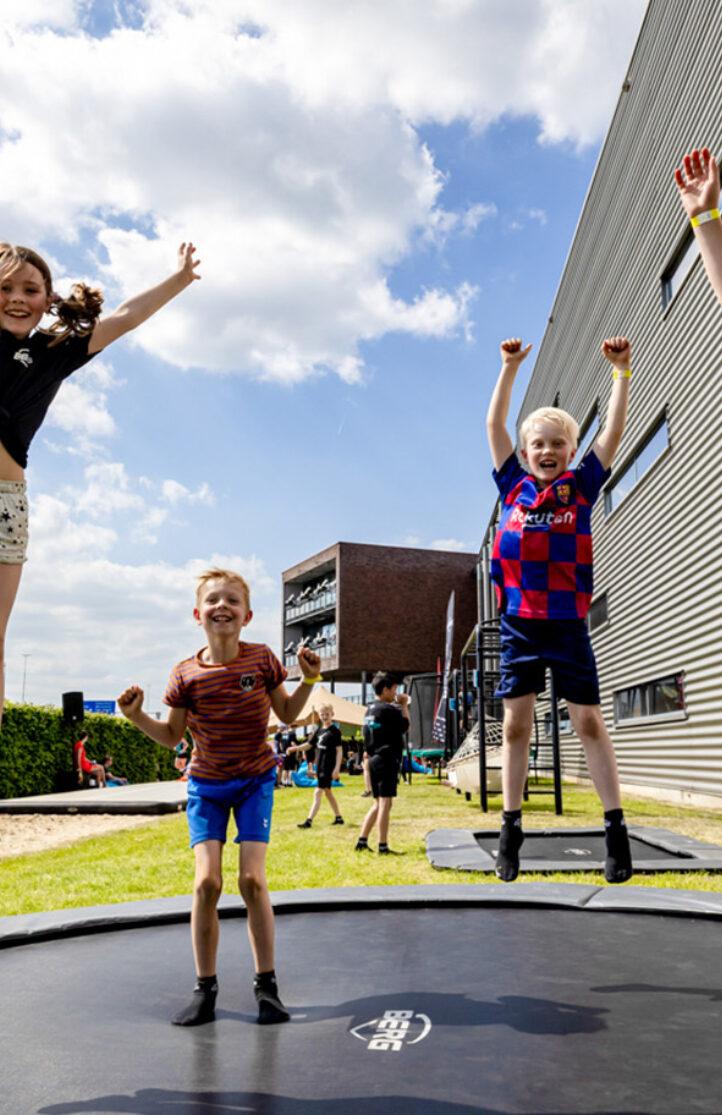 Kids jump on BERG trampolines during BERG Events | Banner