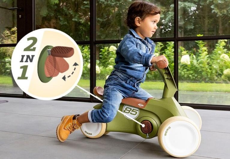 Child riding a BERG GO 2-in-1 ride-on car with foldable pedals